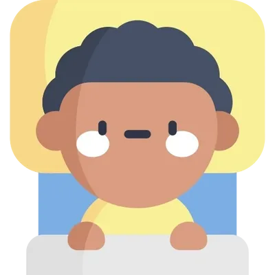 Child lying in bed looking worried